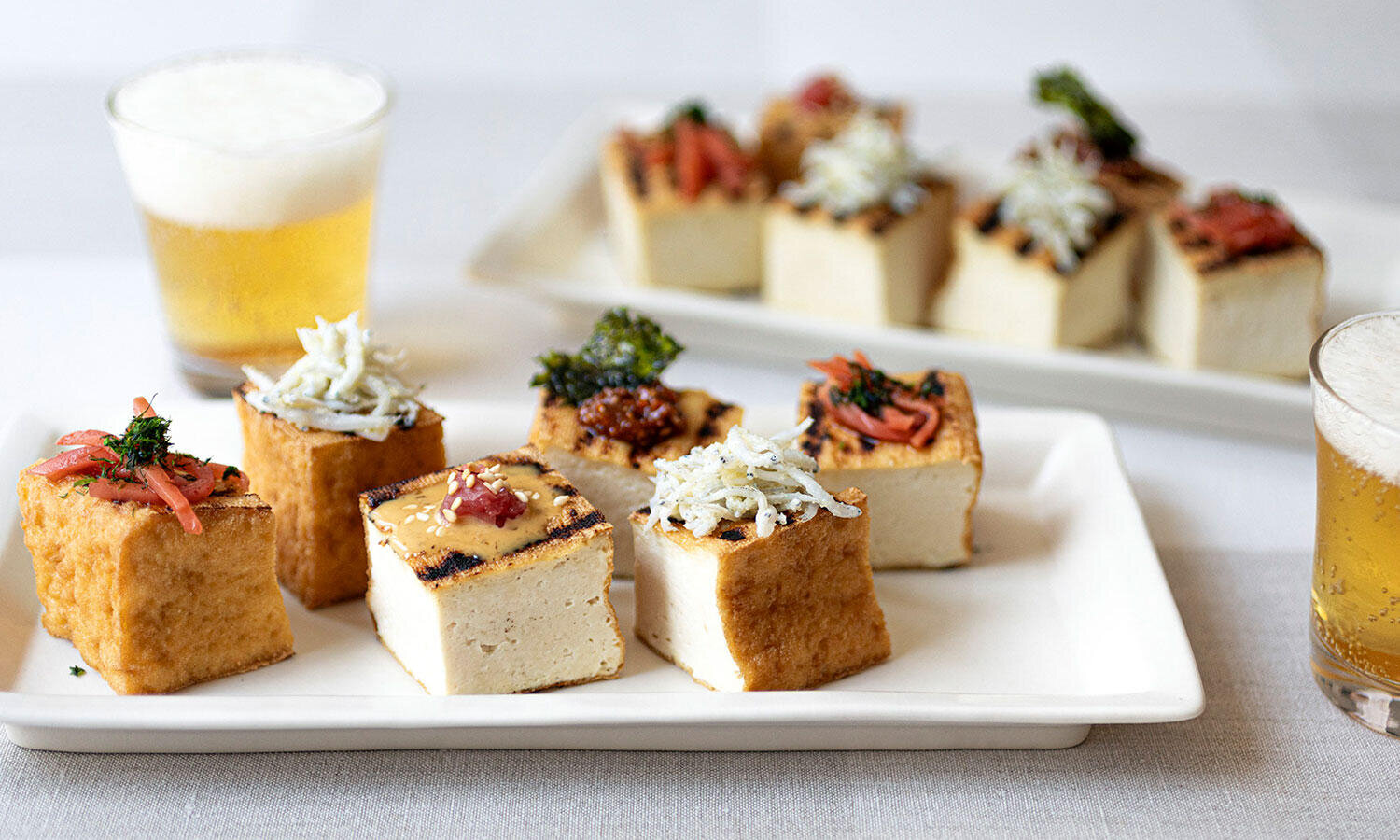 <small>香ばしく焼いた厚揚げを4種類のトッピングで味変</small><br>ひと口焼き厚揚げのいろいろトッピング
